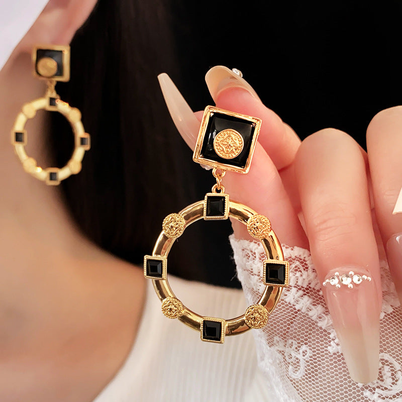 beautiful black and gold colored ear rings